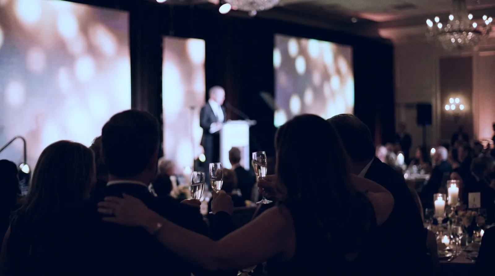 Fundraising gala production with elegant stage lighting